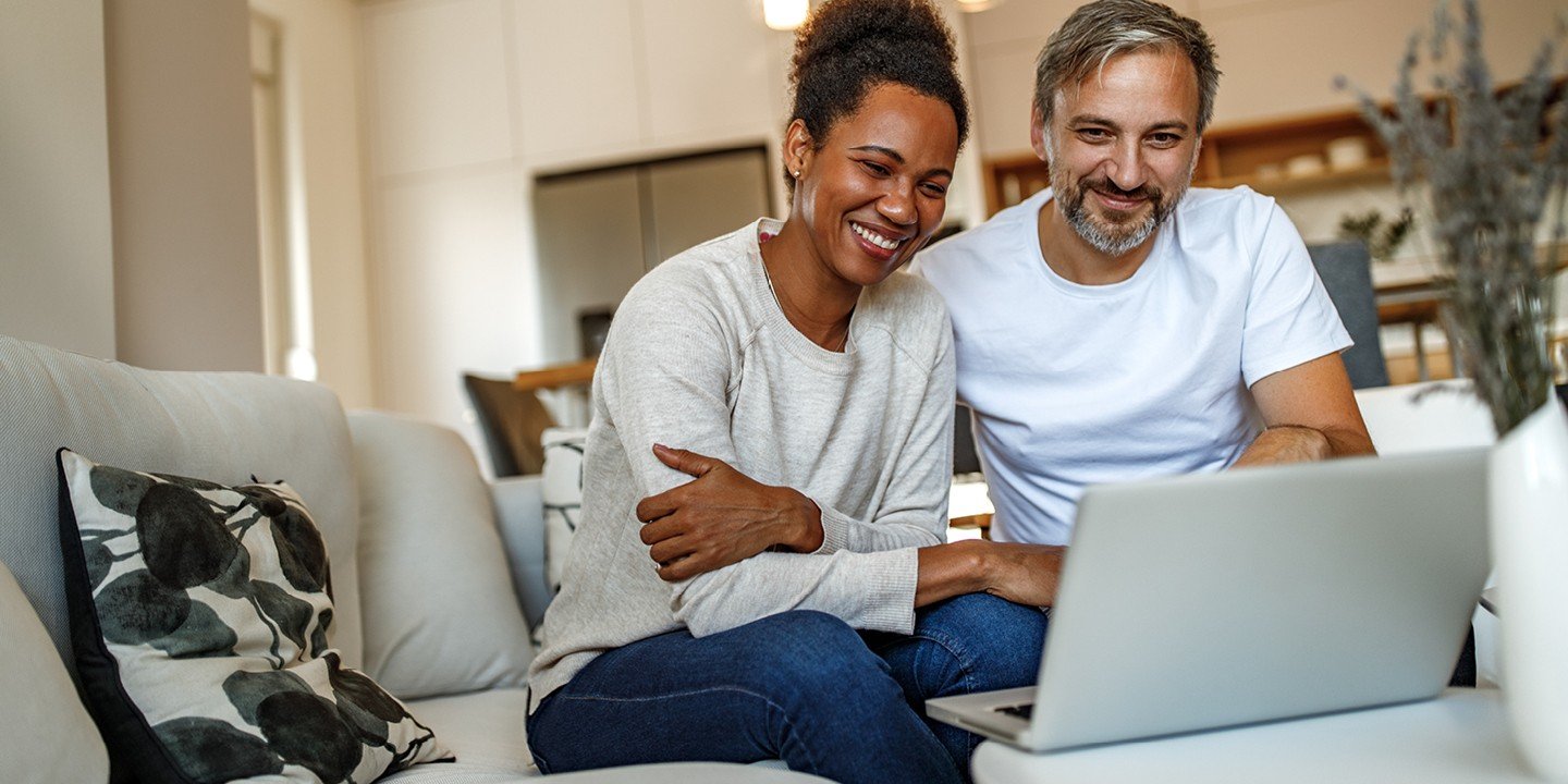 Couple browse the Marsden website at home from their laptop