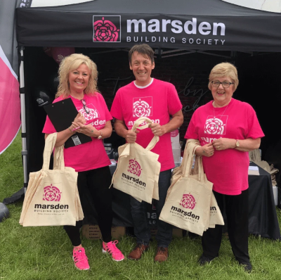 Three members of the Marsden team at the Great Eccleston Show holding tote bags