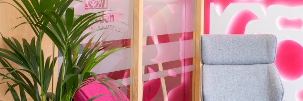 Close up of the interior of a Marsden Building Society office featuring the pink rose from their logo.