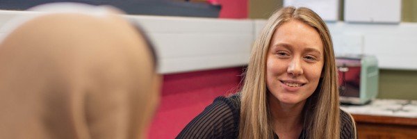 Female colleagues smile as they discuss their future at the Marsden